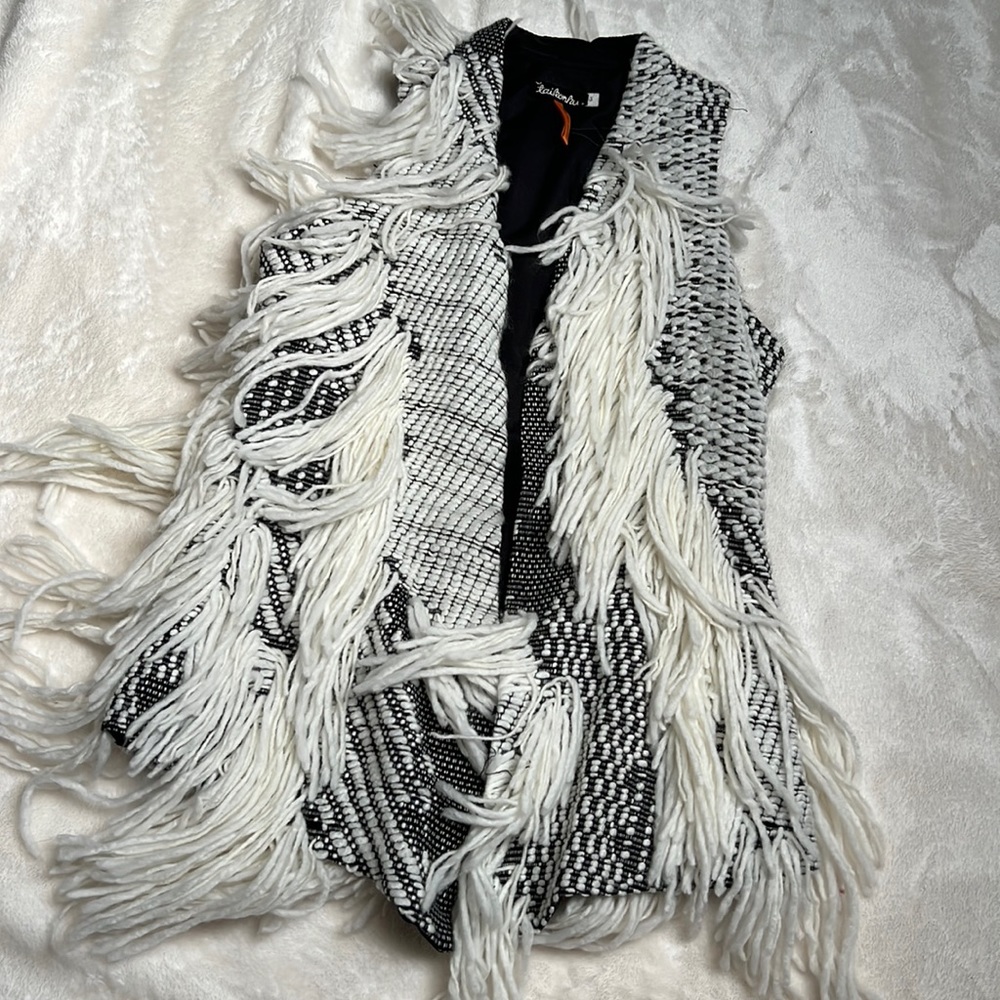 Beautiful fringe vest vintage! Got it at a boutique store.